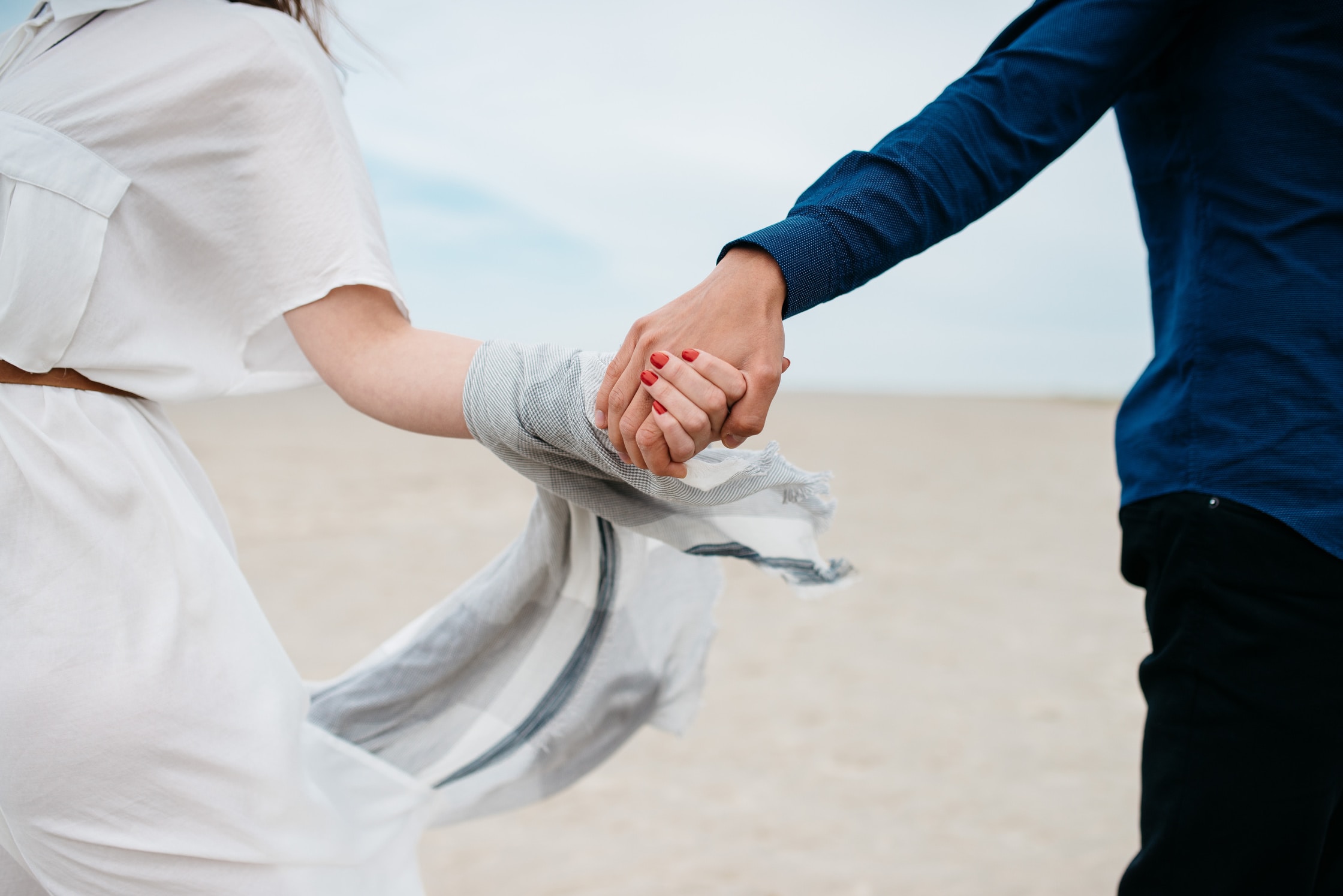 image of boy and a girl holding hands